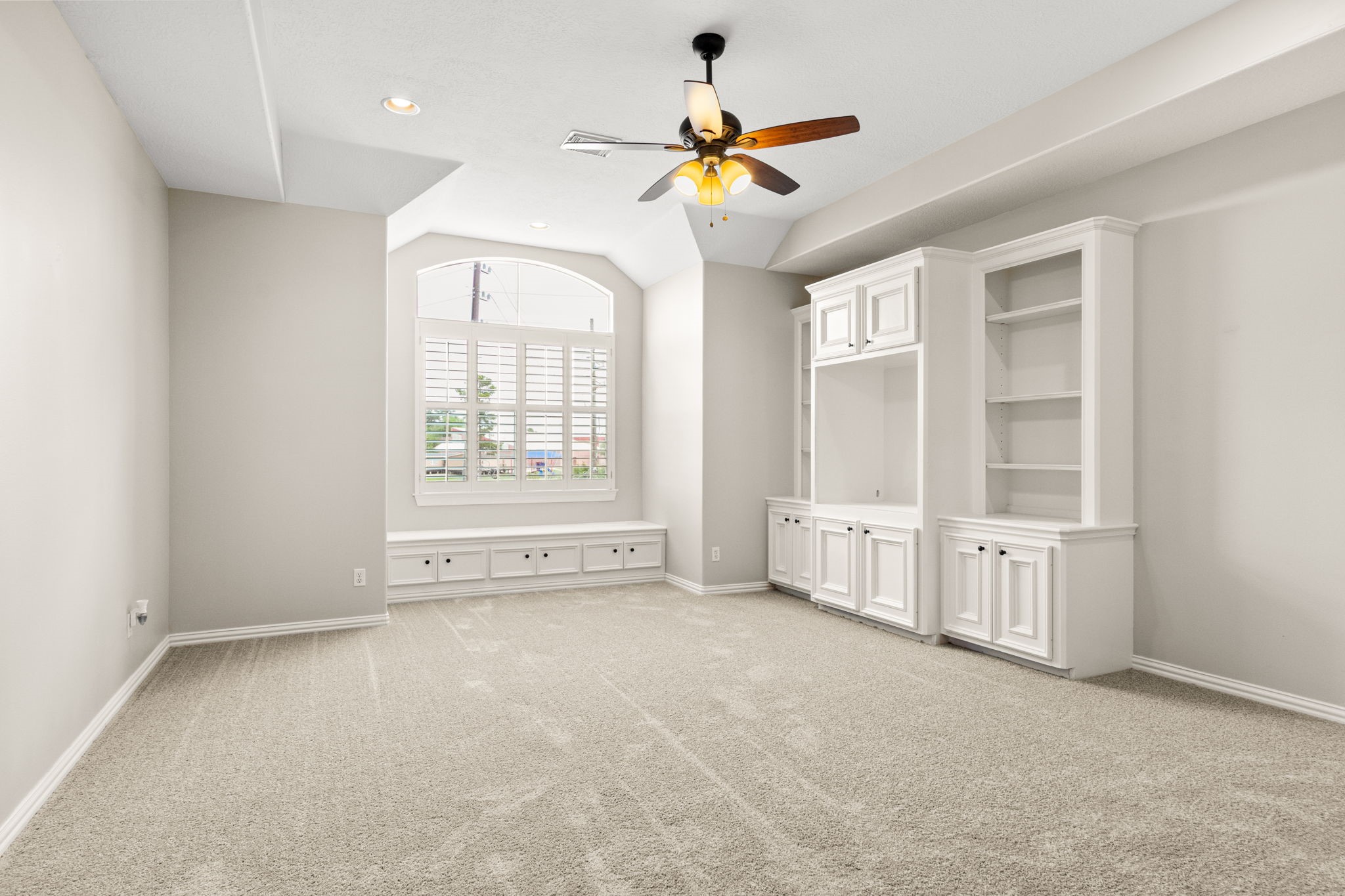 5803 Desert Oak Way Spring, TX 77379 - Photo 29 of 50 Upstairs Game Room with window seat and Built ins for ample storage of all the toys, games and movies.