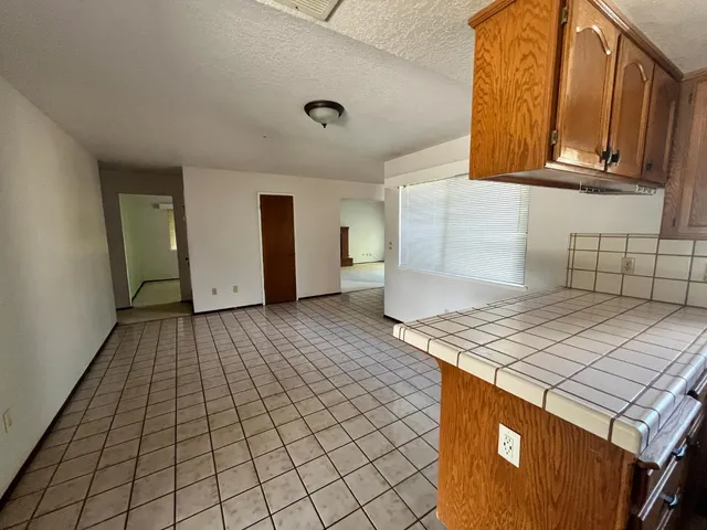 a kitchen that has a cabinets and a stove top oven