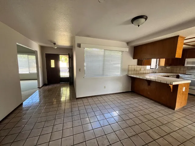 a view of a kitchen cabinets and a counter place