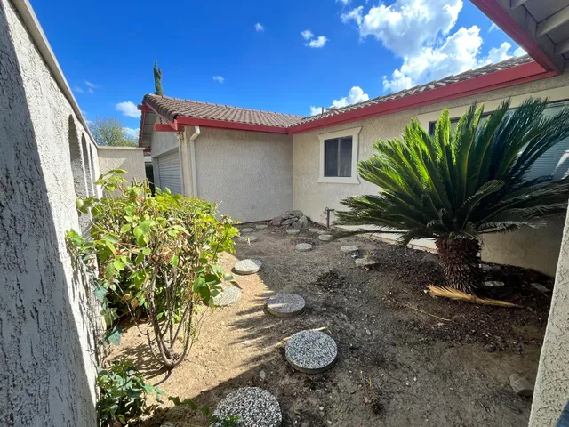 a view of a backyard with garden
