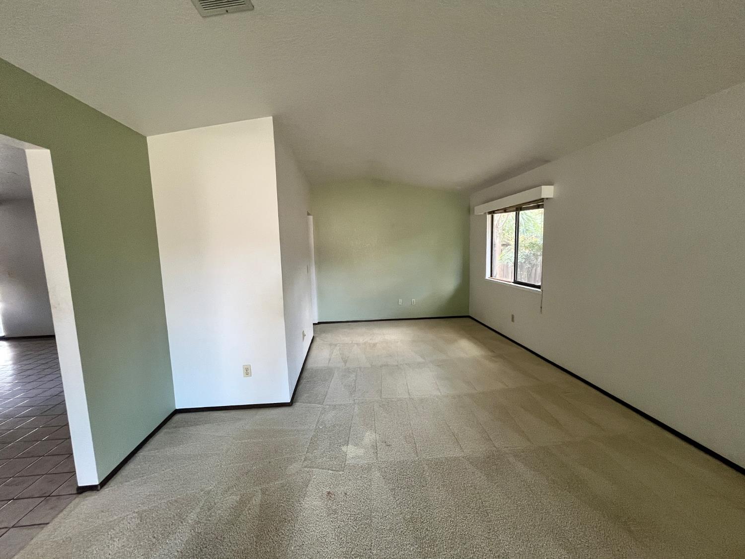 312 Roxanne Drive Patterson, CA 95363 - Photo 10 of 28 a view of an empty room with a window