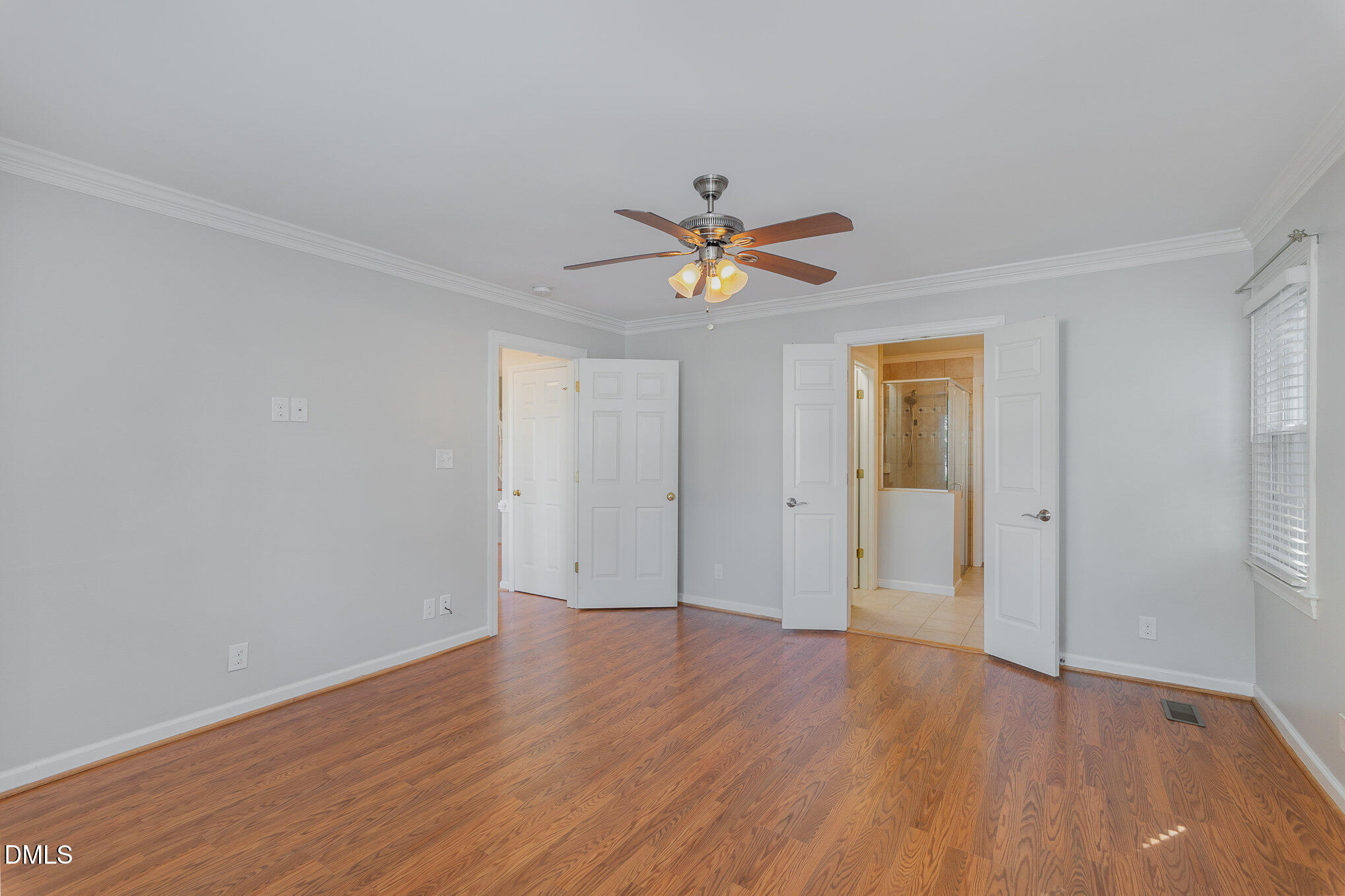 1437 Greenside Drive Raleigh, NC 27609 - Photo 14 of 27 a view of an empty room with wooden floor