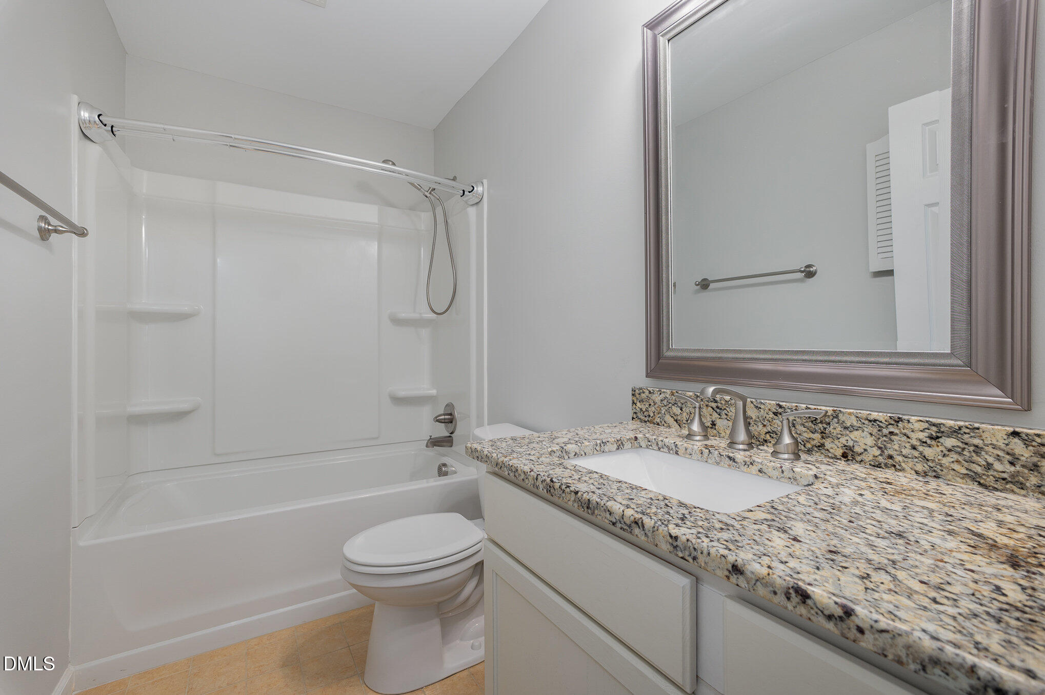 1437 Greenside Drive Raleigh, NC 27609 - Photo 20 of 27 a bathroom with a granite countertop sink toilet and shower