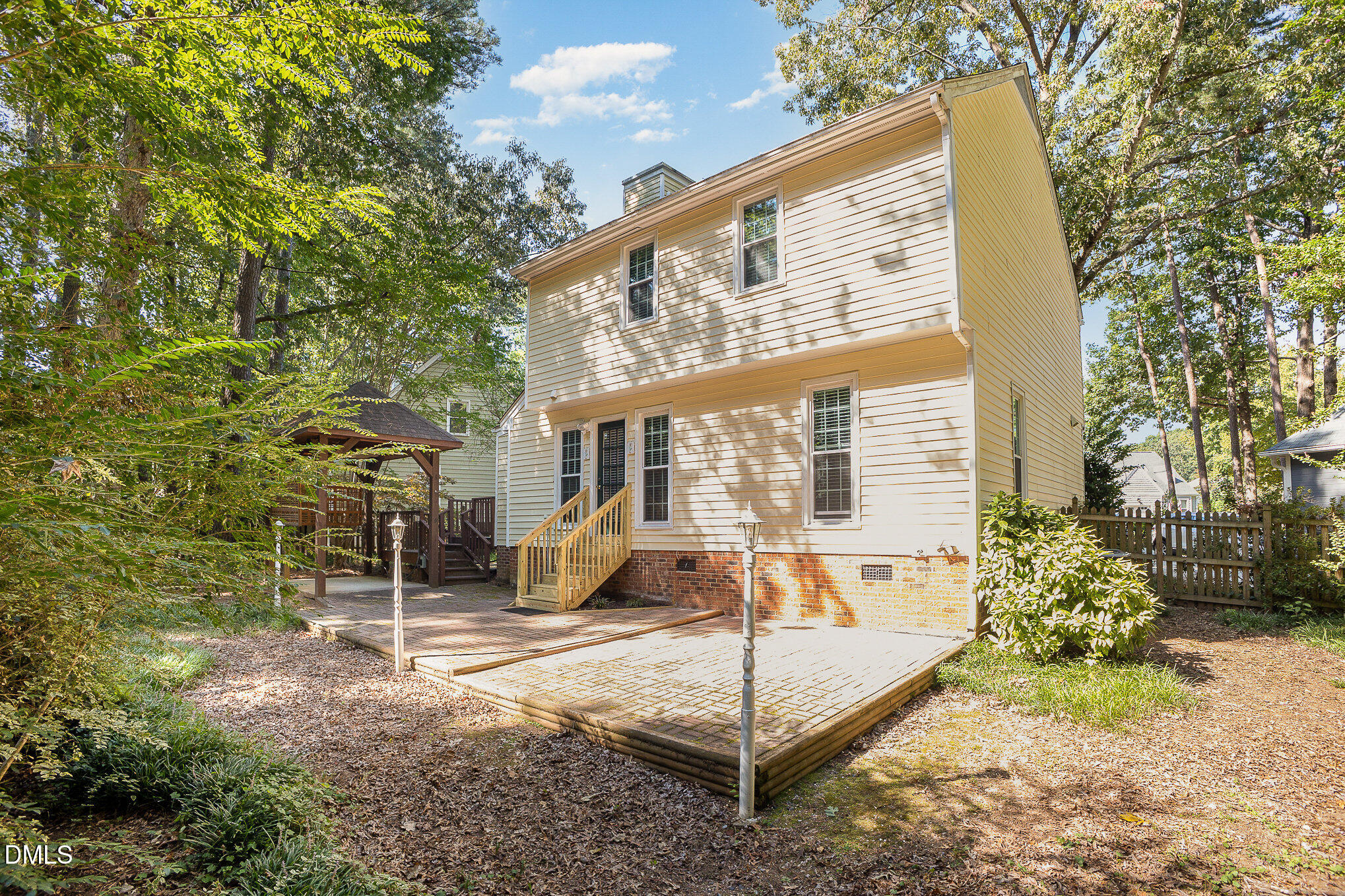 1437 Greenside Drive Raleigh, NC 27609 - Photo 23 of 27 a view of a house with backyard and sitting area