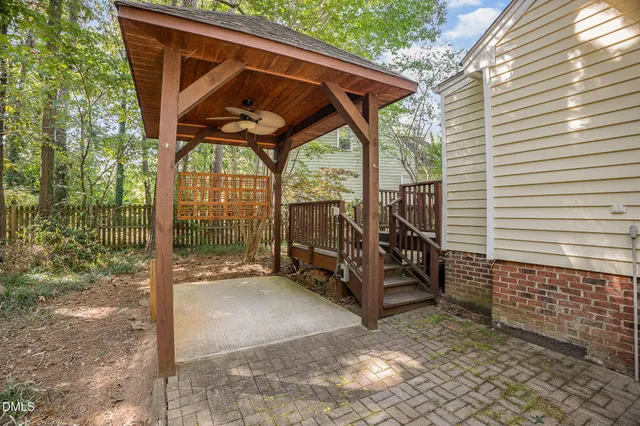 a view of balcony with wooden floor and outdoor seating