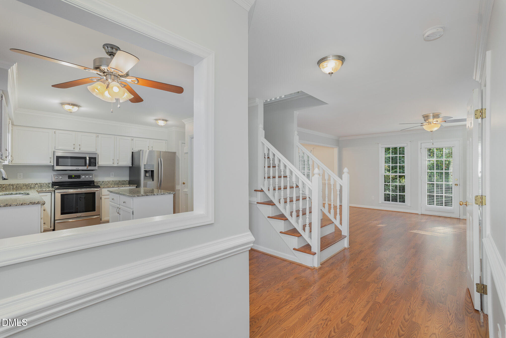1437 Greenside Drive Raleigh, NC 27609 - Photo 4 of 27 a view of an entryway and wooden floor