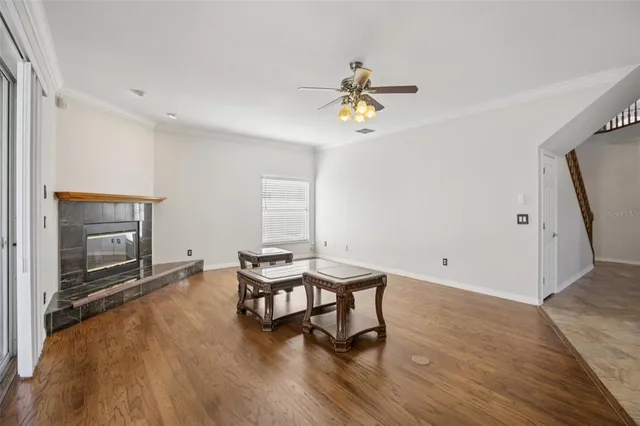 a living room with furniture a fireplace and a table