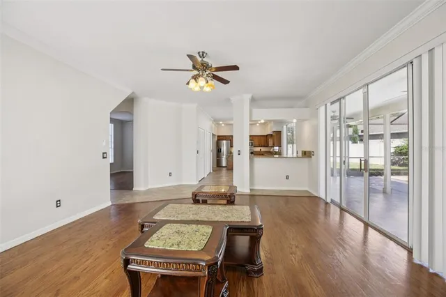 a kitchen with stainless steel appliances granite countertop a sink dishwasher stove top oven and refrigerator with wooden floor