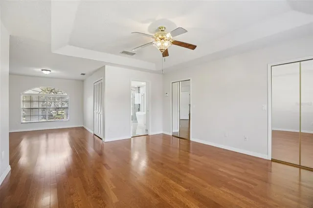 a spacious bathroom with a double vanity sink and mirror