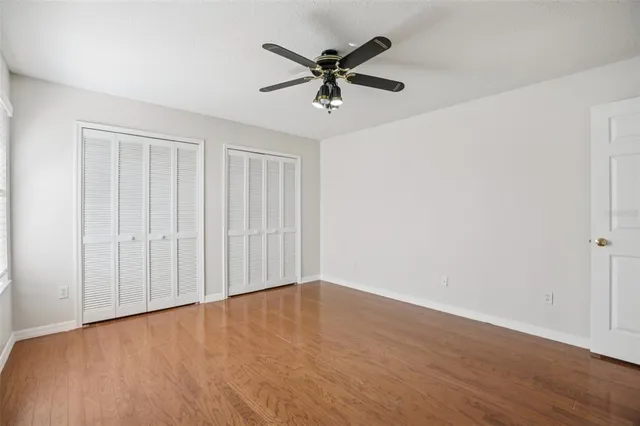 a view of a porch with furniture and floor to ceiling window