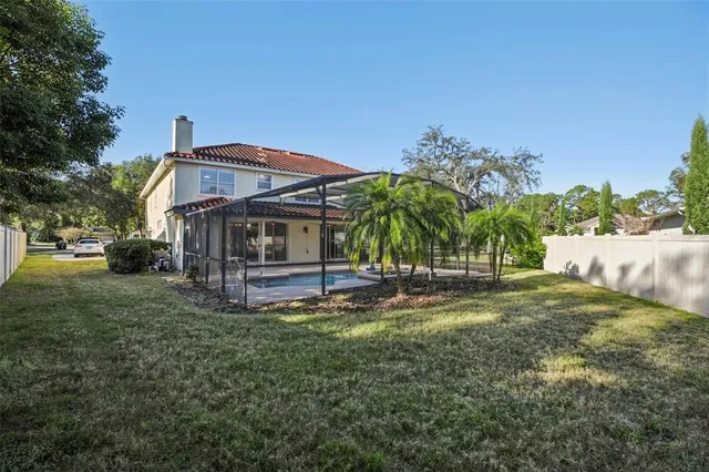 a view of yard with swimming pool and green space