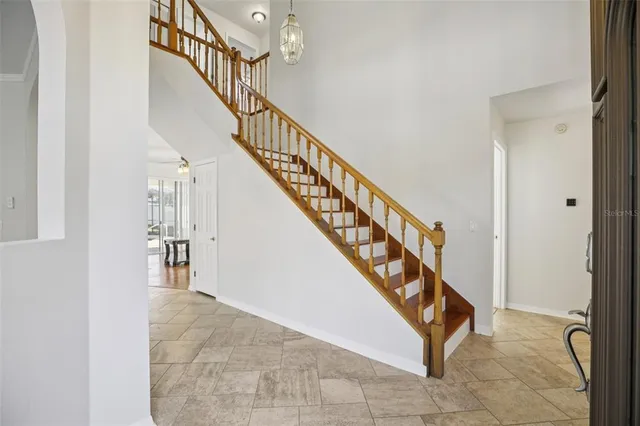 an empty room with windows and entrance