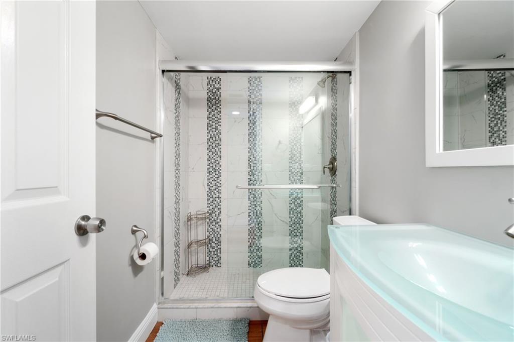 4572 Andover Way, Unit C105 Naples, FL 34112 - Photo 20 of 50 a bathroom with a shower and a toilet