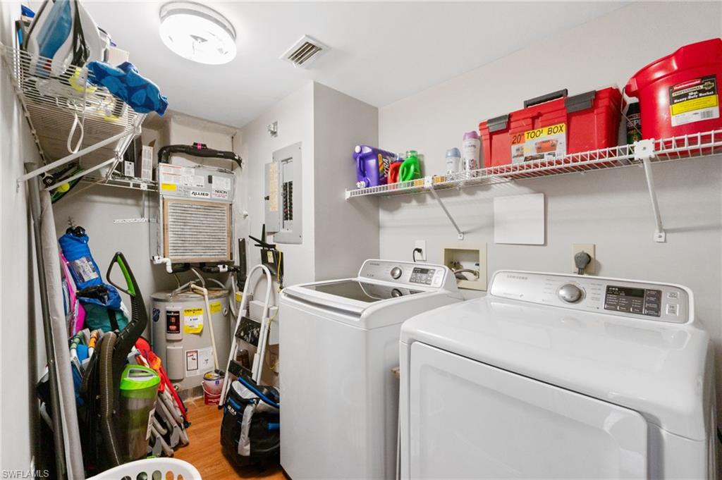 4572 Andover Way, Unit C105 Naples, FL 34112 - Photo 21 of 50 a utility room with dryer and washer