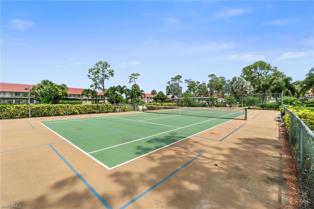 4572 Andover Way, Unit C105 Naples, FL 34112 - Photo 30 of 50 a view of a tennis court