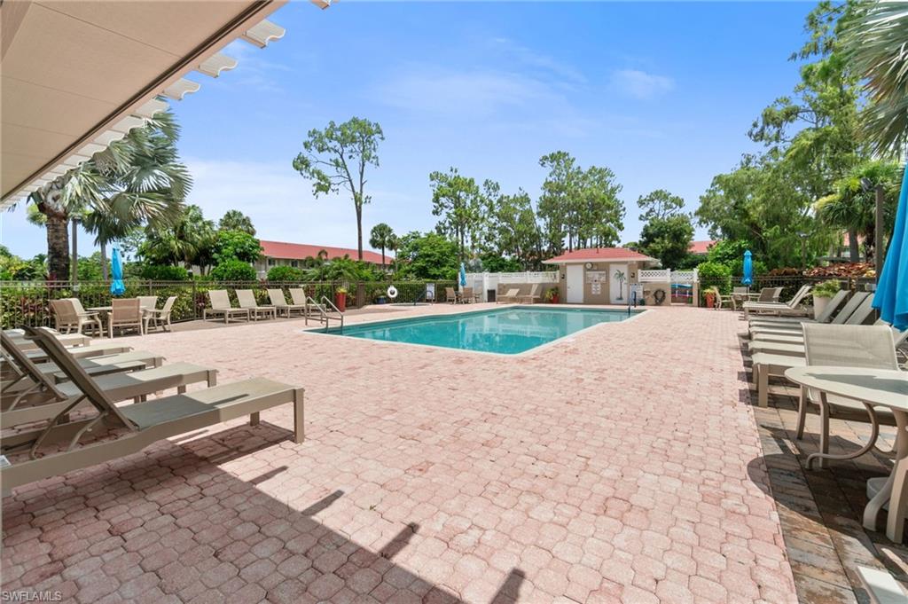 4572 Andover Way, Unit C105 Naples, FL 34112 - Photo 35 of 50 a view of a backyard