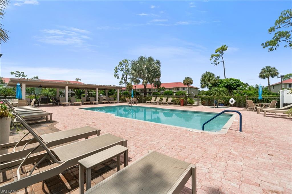 4572 Andover Way, Unit C105 Naples, FL 34112 - Photo 36 of 50 a view of a swimming pool with a patio