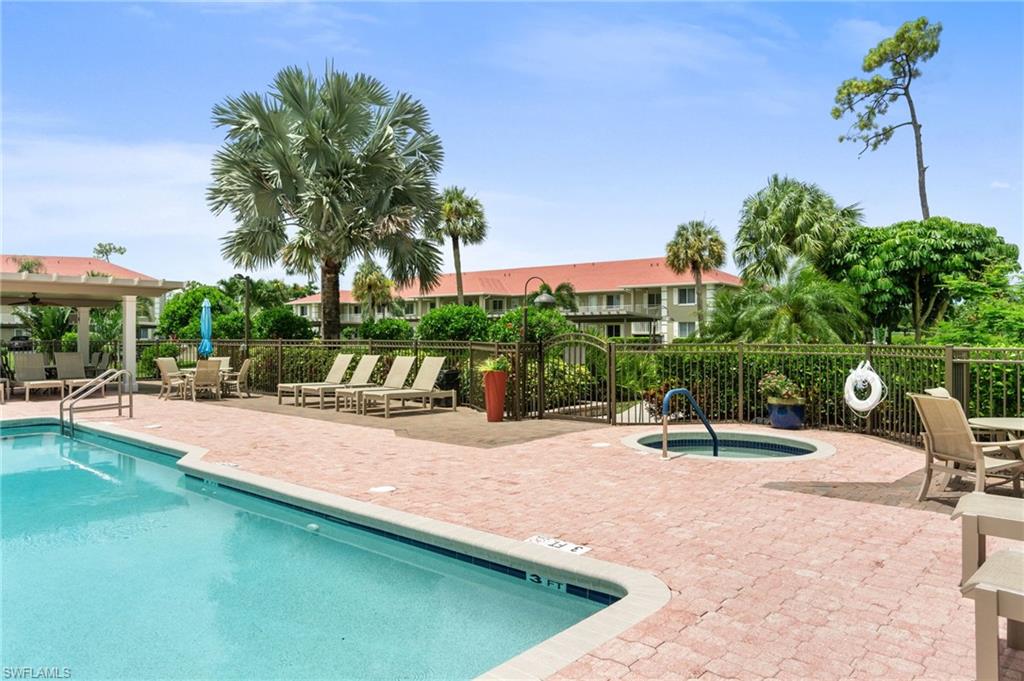 4572 Andover Way, Unit C105 Naples, FL 34112 - Photo 37 of 50 a view of a backyard with a sitting area