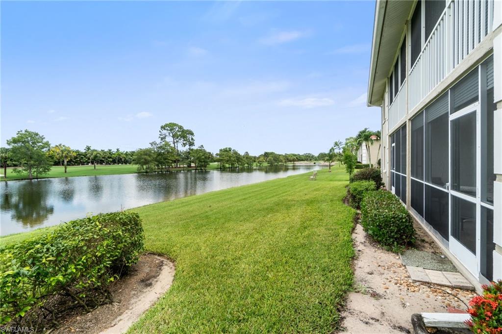 4572 Andover Way, Unit C105 Naples, FL 34112 - Photo 39 of 50 a view of a garden with a lake