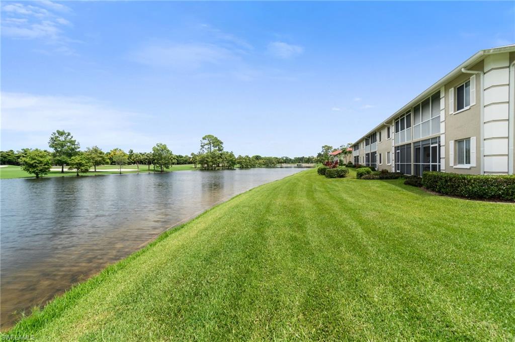 4572 Andover Way, Unit C105 Naples, FL 34112 - Photo 41 of 50 a view of a house with a yard and a lake view