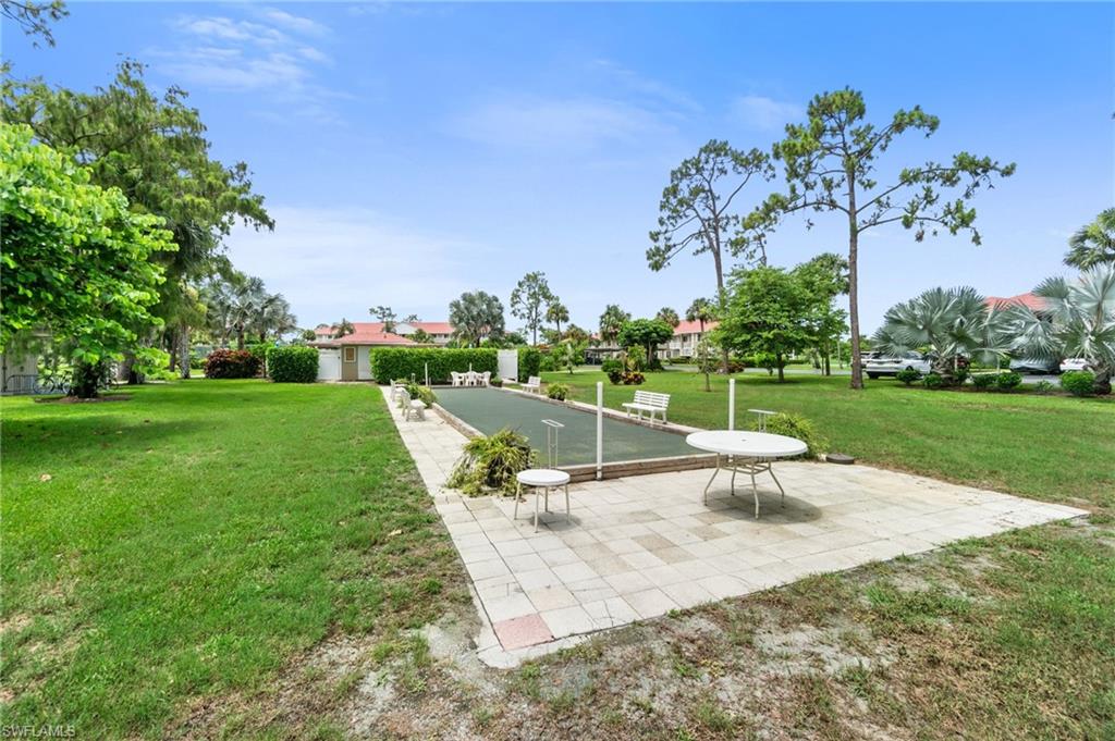 4572 Andover Way, Unit C105 Naples, FL 34112 - Photo 48 of 50 a view of a park with plants and trees