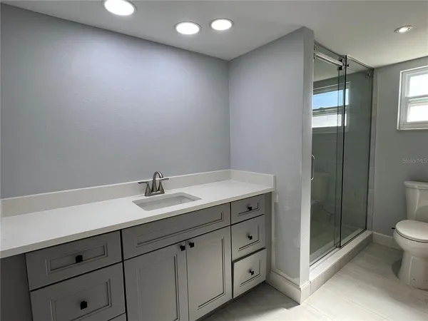 a bathroom with a sink and mirror