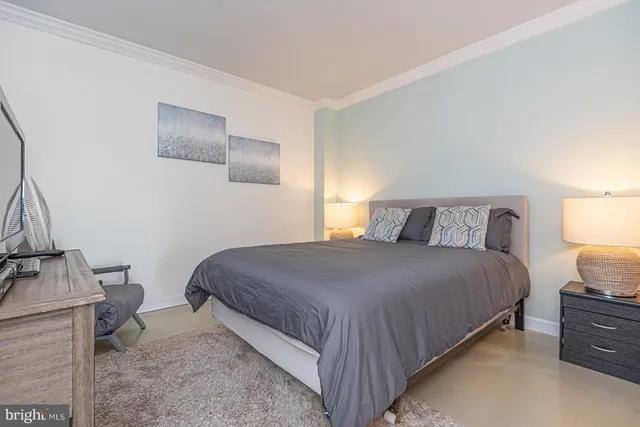 a bedroom with a bed and chair