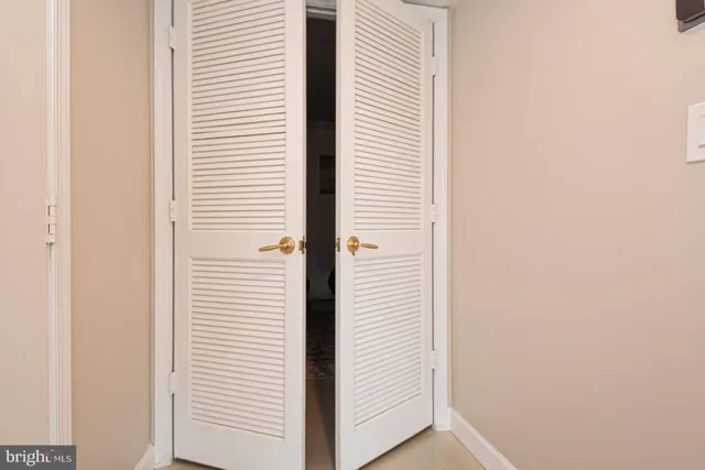 a view of a hallway with white walls