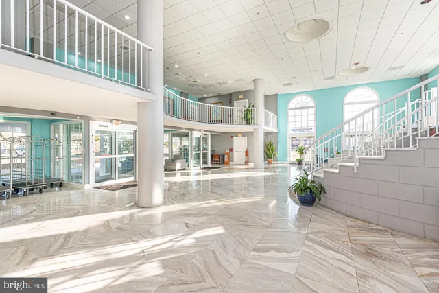 a view of lobby with furniture and wooden floor