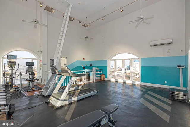 a room with lots of furniture and a rug