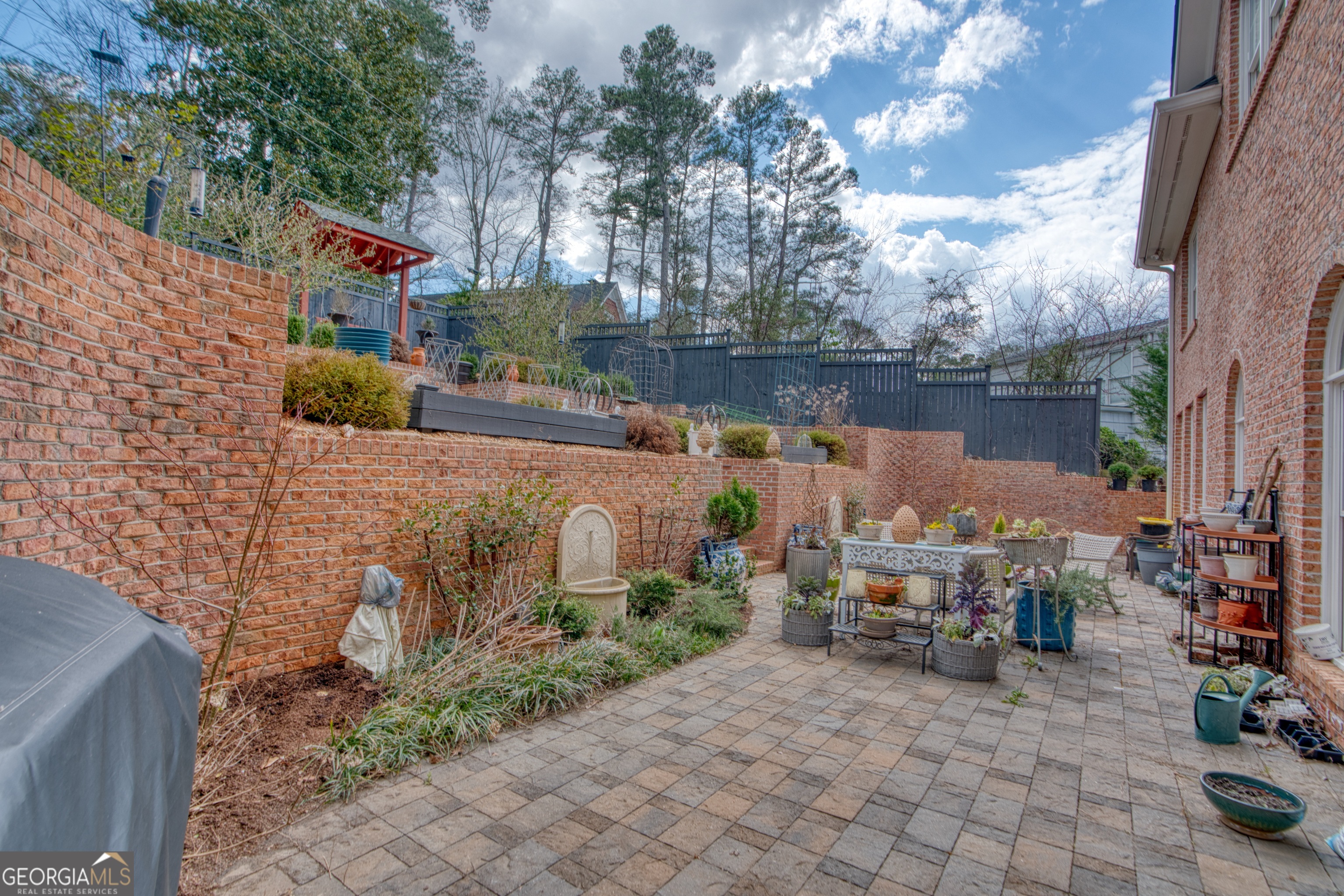 201 Bass Avenue Southwest Rome, GA 30165 - Photo 25 of 32 a backyard of a house with lots of green space and fountain