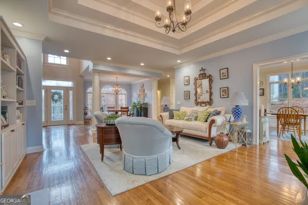 a view of a livingroom with furniture window and wooden floor