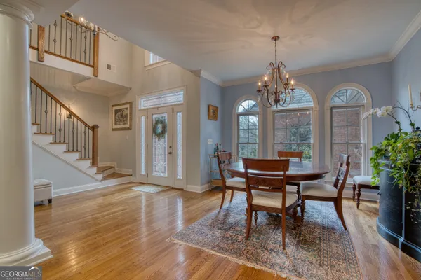 a dinning room and kitchen with a decorative lights