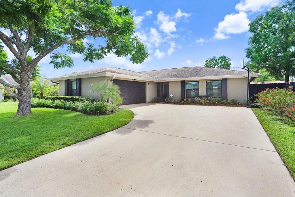 4412 Stonehenge Road Tampa, FL 33624 - Photo 1 of 33 a front view of house with yard and green space