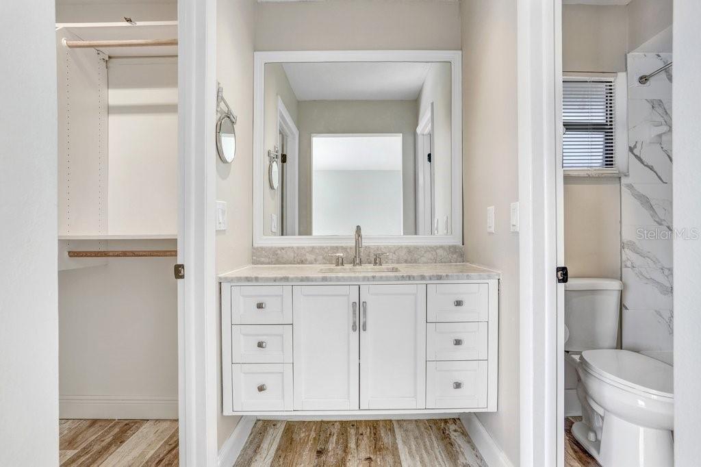 4412 Stonehenge Road Tampa, FL 33624 - Photo 19 of 33 a bathroom with a granite countertop sink toilet and shower