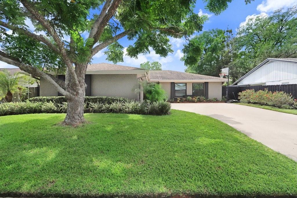 4412 Stonehenge Road Tampa, FL 33624 - Photo 2 of 33 a view of a house with a yard