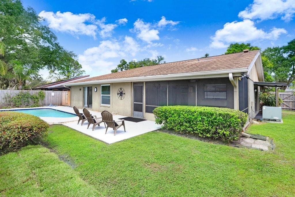 4412 Stonehenge Road Tampa, FL 33624 - Photo 30 of 33 a view of a house with a yard and sitting area