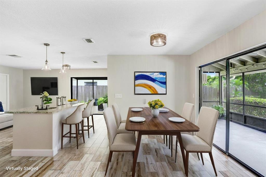 4412 Stonehenge Road Tampa, FL 33624 - Photo 8 of 33 a view of a dining room with furniture window and outside view