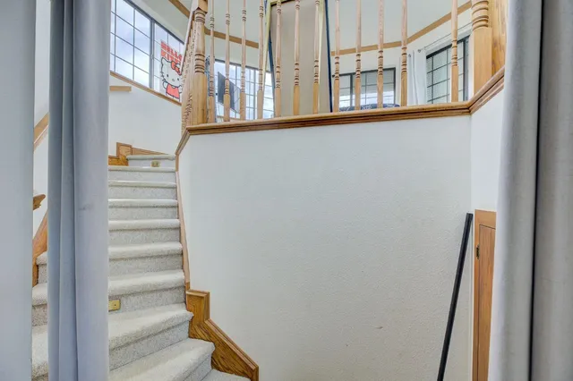 a view of a house next to a big yard