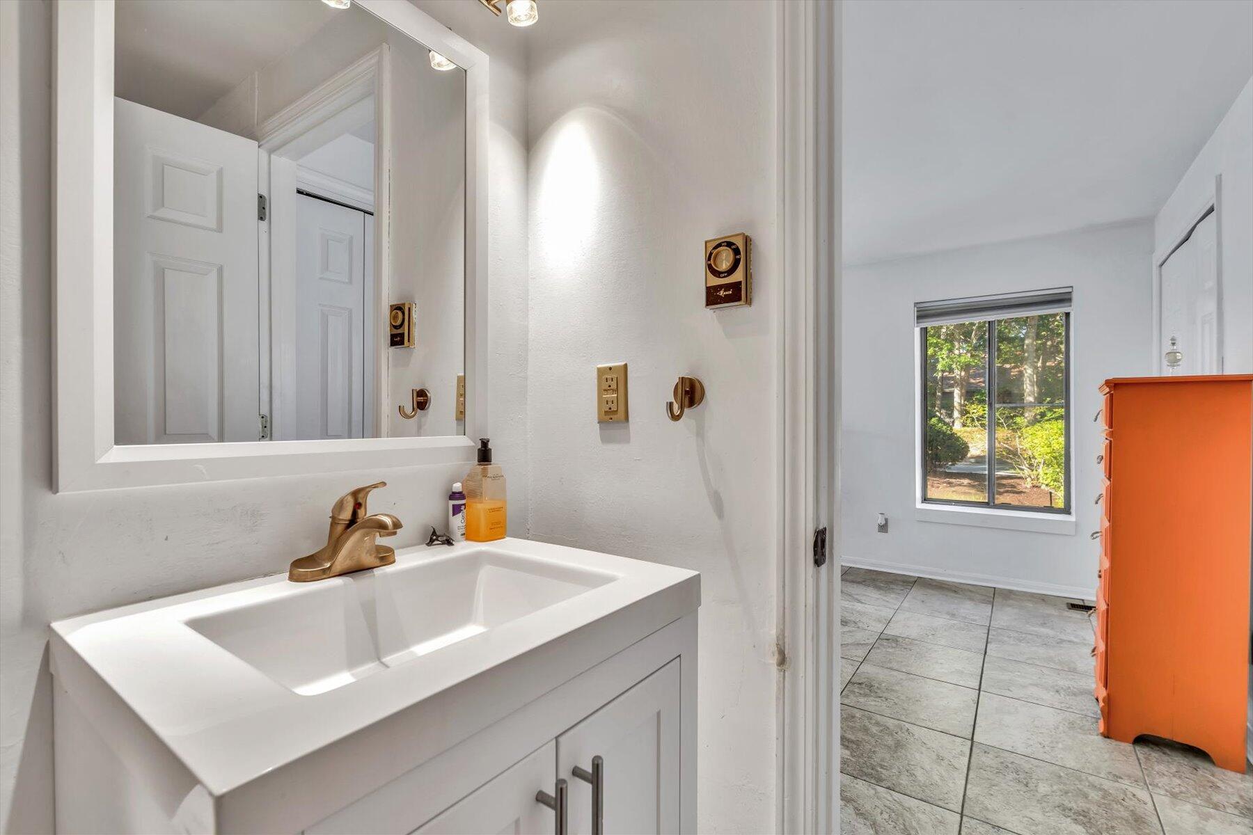 481 Buck Island Road, Unit 9AA West Yarmouth, MA 02673 - Photo 26 of 41 a bathroom with a sink and a mirror