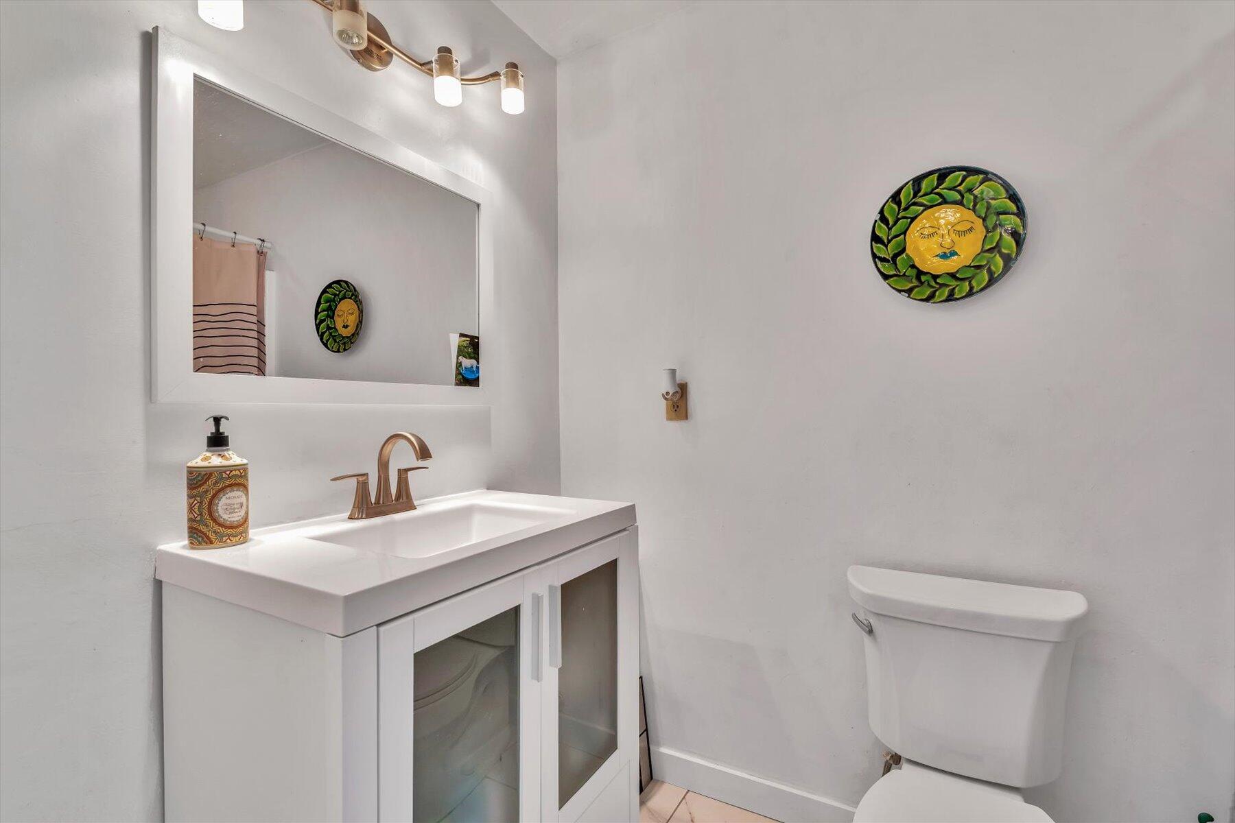 481 Buck Island Road, Unit 9AA West Yarmouth, MA 02673 - Photo 31 of 41 a bathroom with a sink a vanity and a mirror