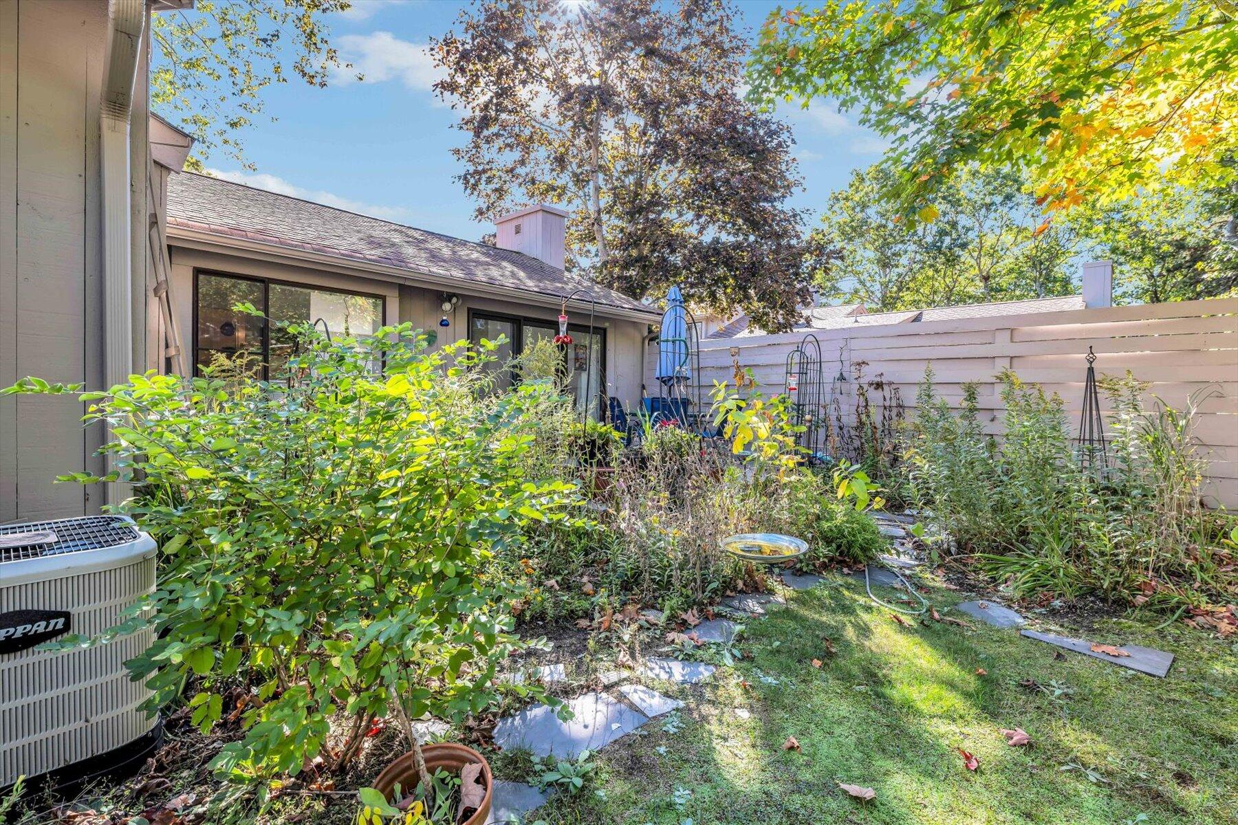 481 Buck Island Road, Unit 9AA West Yarmouth, MA 02673 - Photo 38 of 41 a view of a house with a flower garden