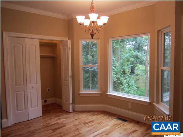 2410 Wakefield Road Charlottesville, VA 22901 - Photo 4 of 32 a view of a room with a large window and wooden floor