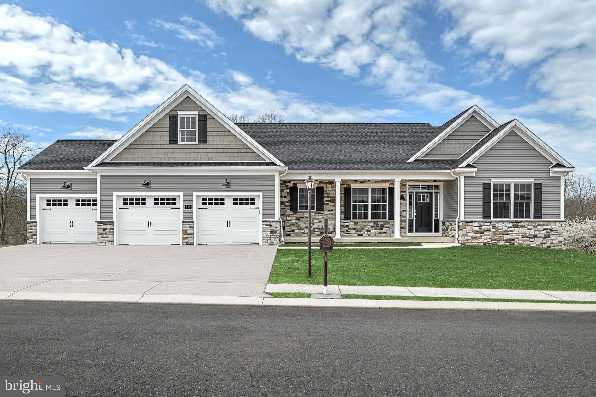 2210 Harney Road Littlestown, PA 17340 - Photo 1 of 1 a front view of a house with a garden