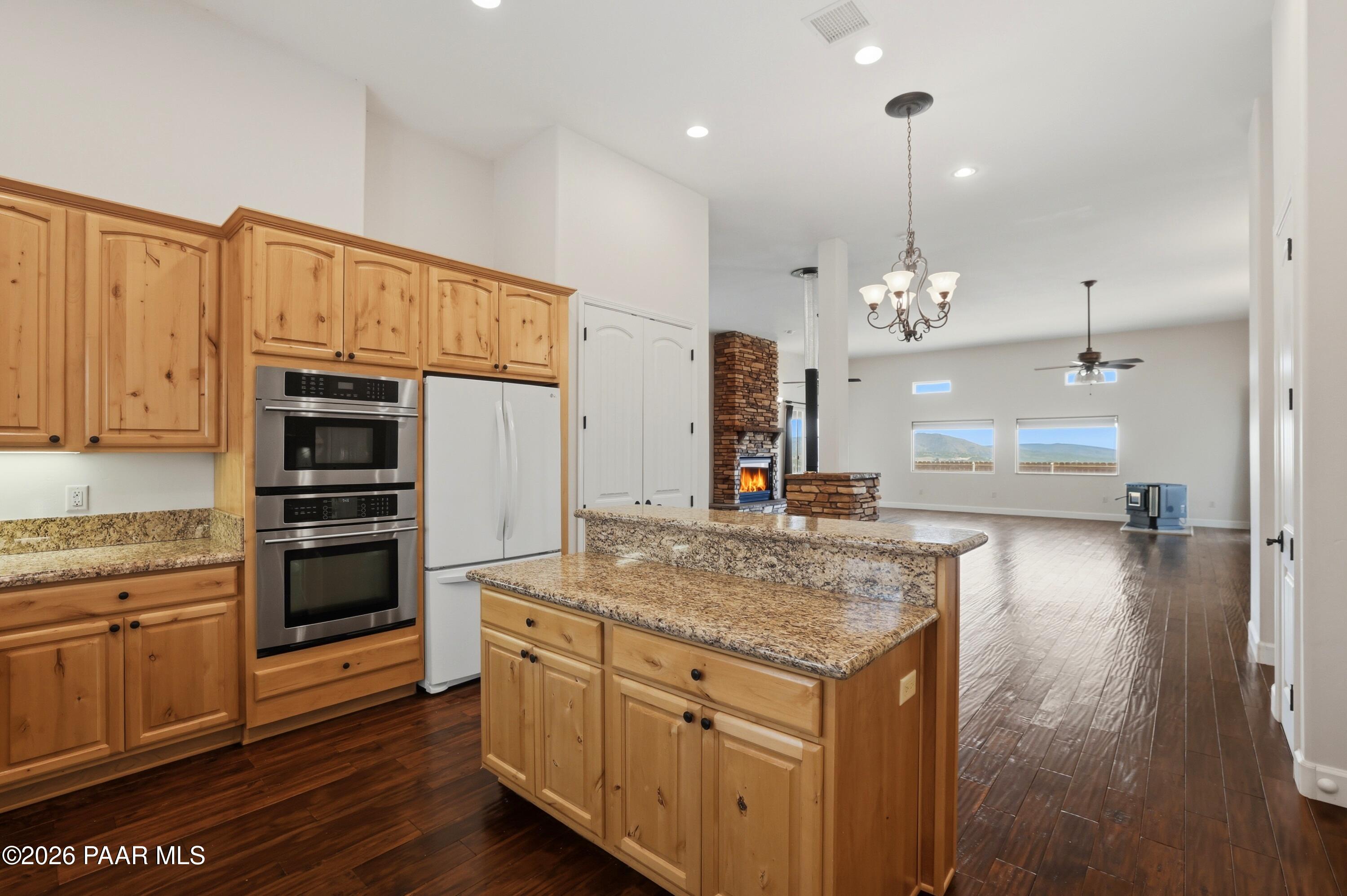 15975 Pandy Lane Dewey, AZ 86327 - Photo 18 of 39 a kitchen with stainless steel appliances granite countertop a stove and a refrigerator