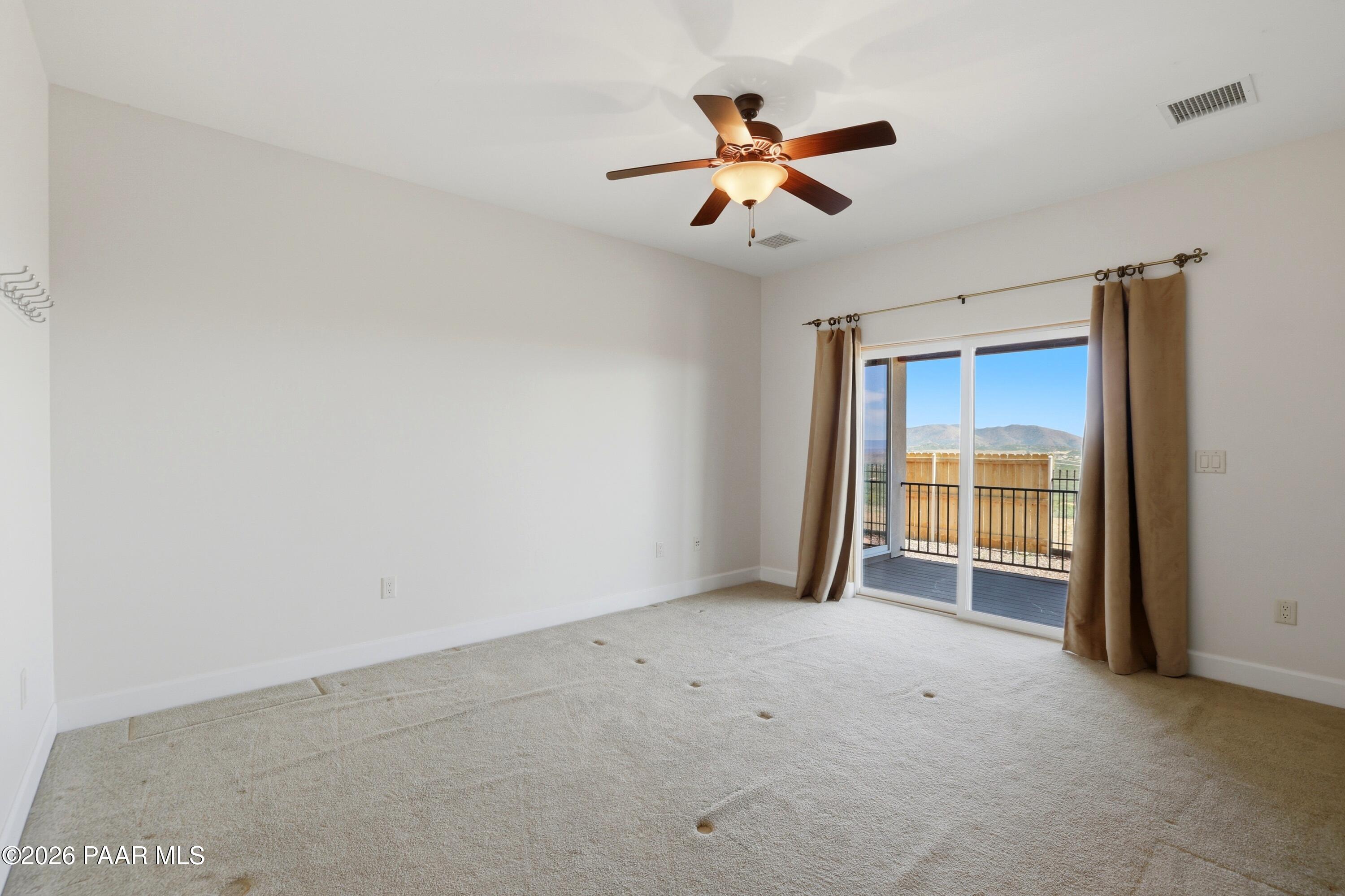 15975 Pandy Lane Dewey, AZ 86327 - Photo 25 of 39 an empty room with a empty space and a ceiling fan