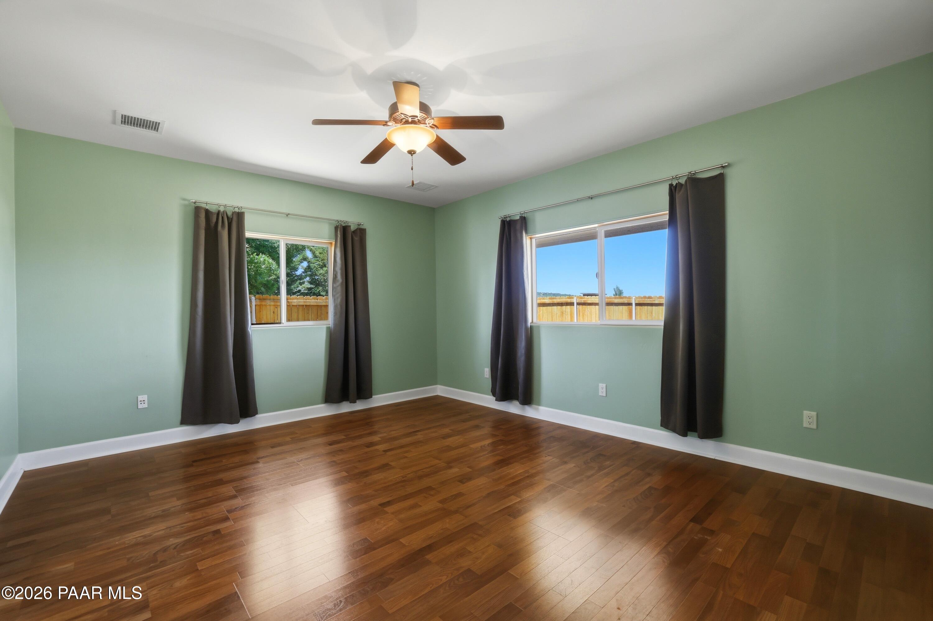 15975 Pandy Lane Dewey, AZ 86327 - Photo 28 of 39 a view of an empty room with wooden floor and a window