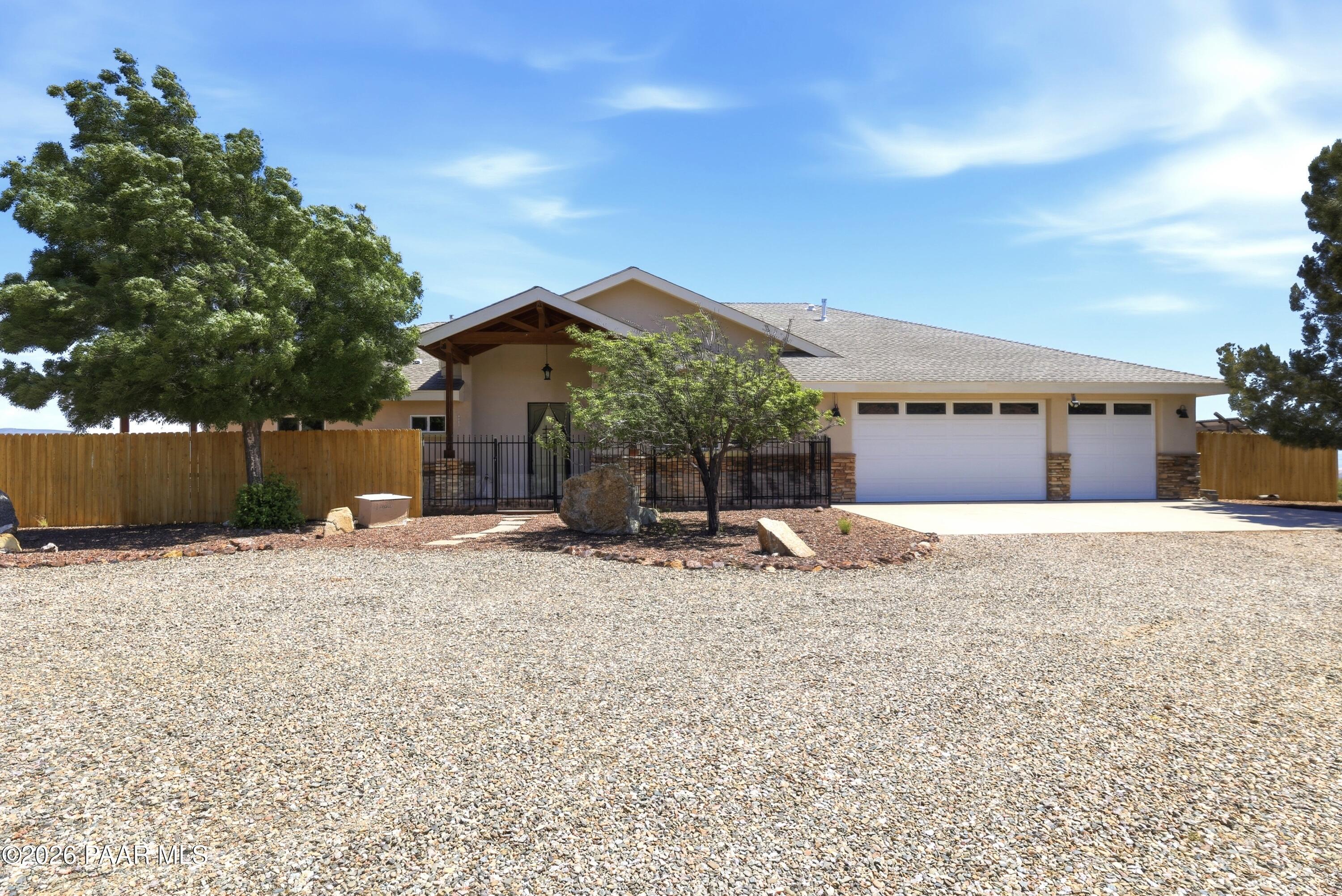 15975 Pandy Lane Dewey, AZ 86327 - Photo 5 of 39 a view of a house with a yard and wooden fence