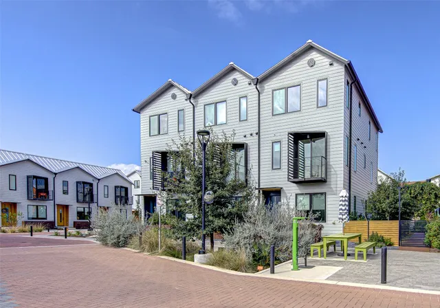 a front view of residential houses with street
