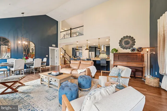 a living room with furniture and a book shelf